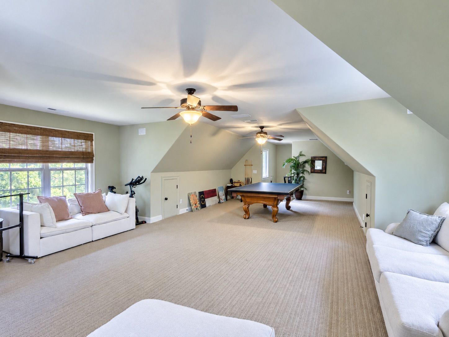 Bonus room with sofas, dormer windows and billiards table