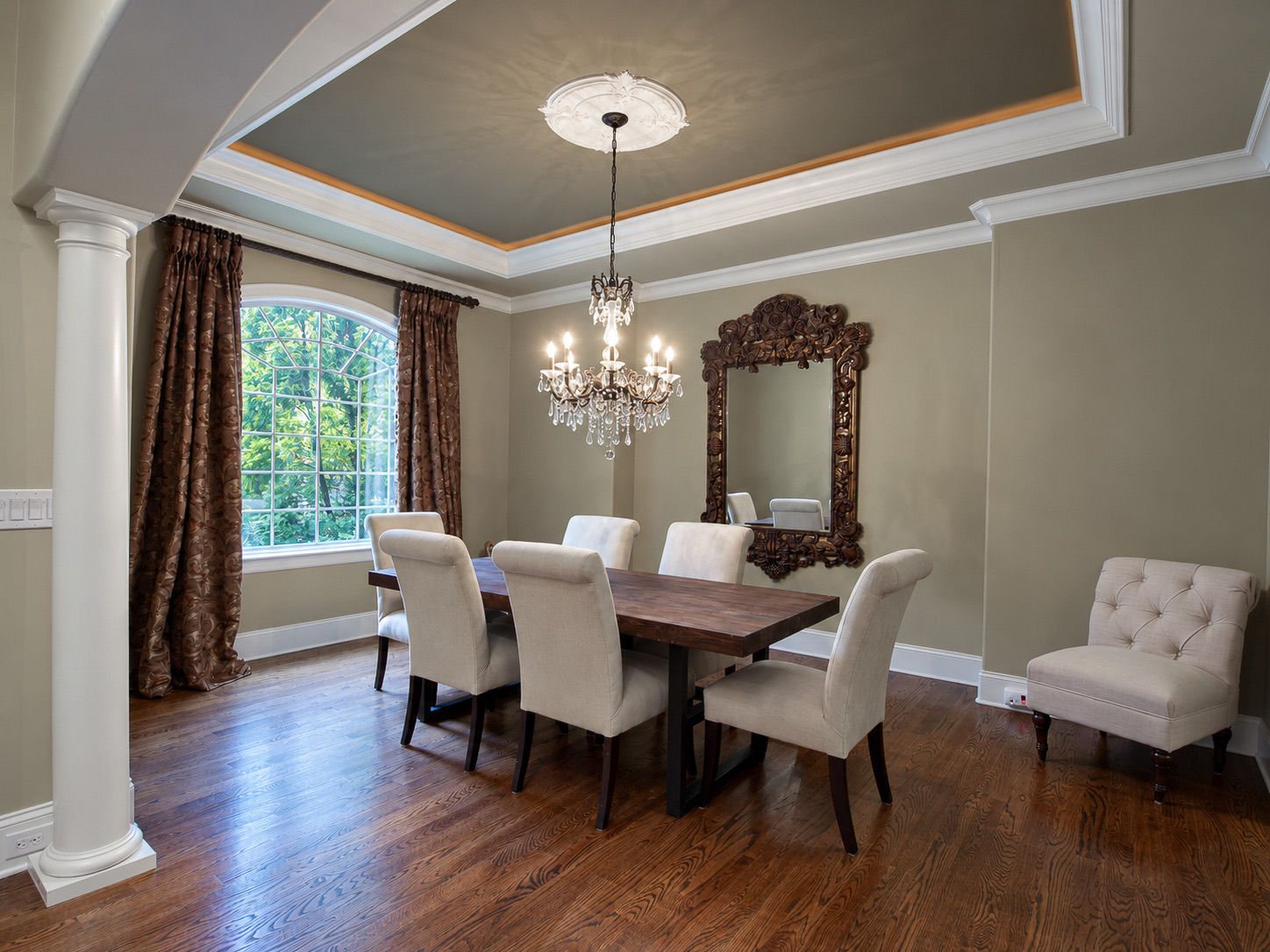 Formal dining room with chandelier and tray ceiling