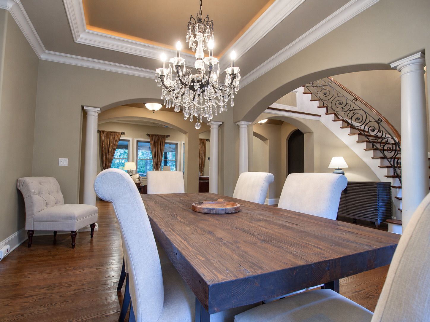 Dining room with crystal chandelier and view to the staircase