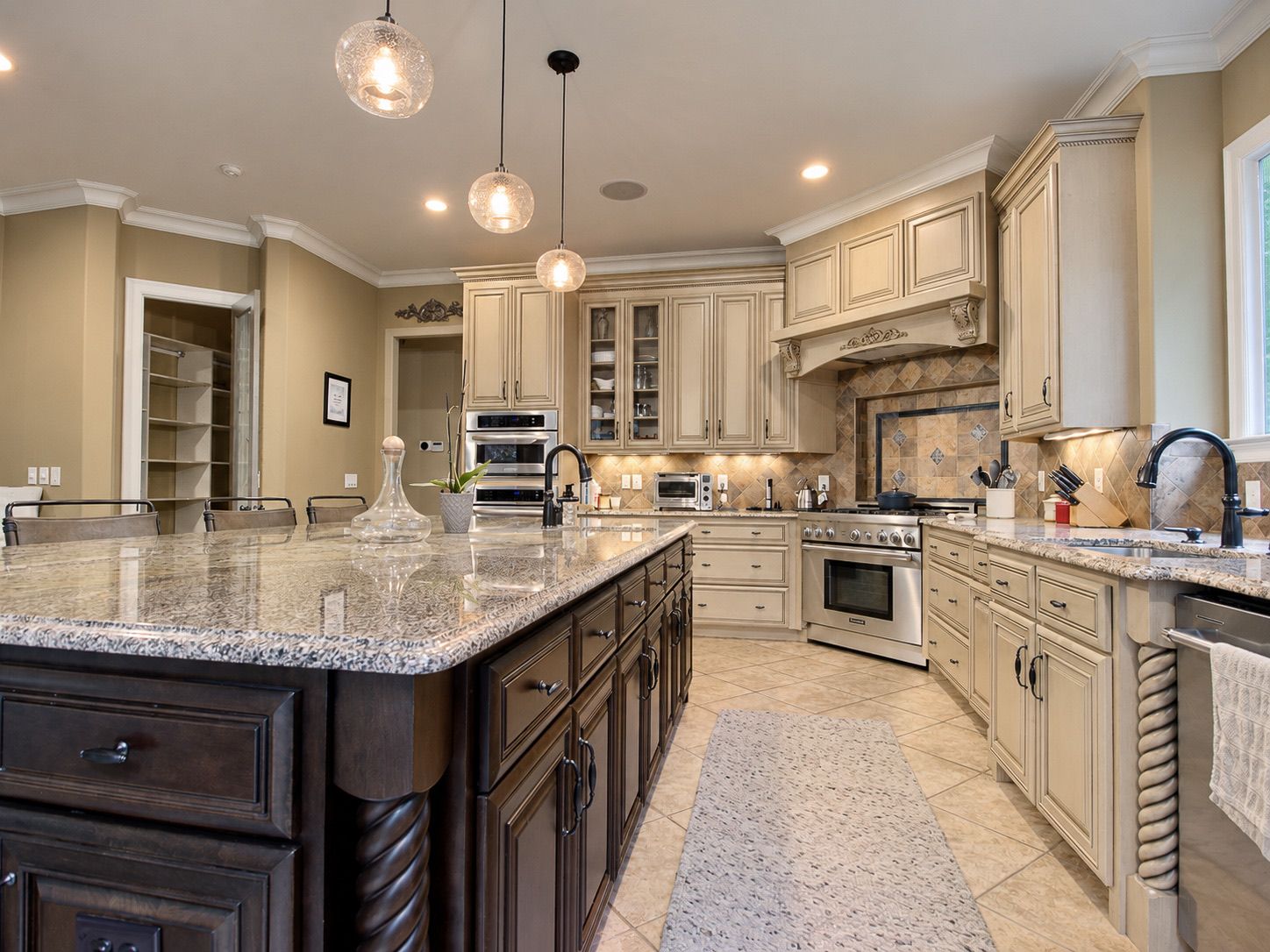 Kitchen island with granite counters and dark wood base